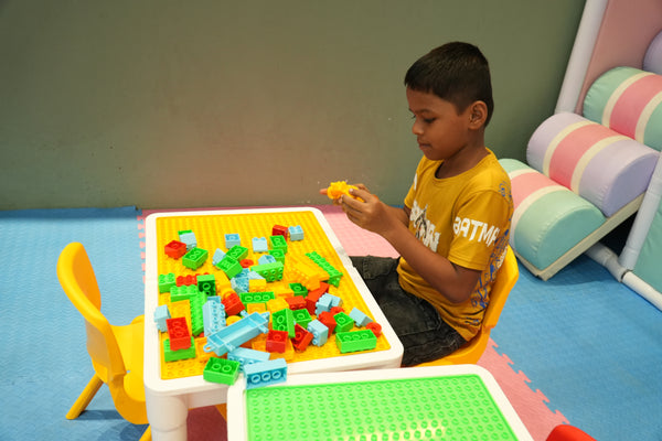 Lego Table Kid playing in toddler zone