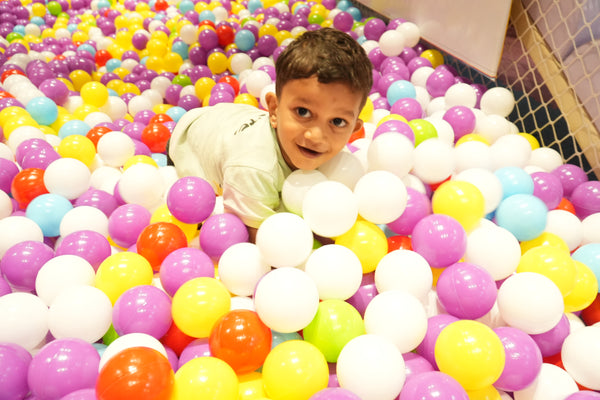 Toddler in ball pool at Zingo Kids indoor play zone